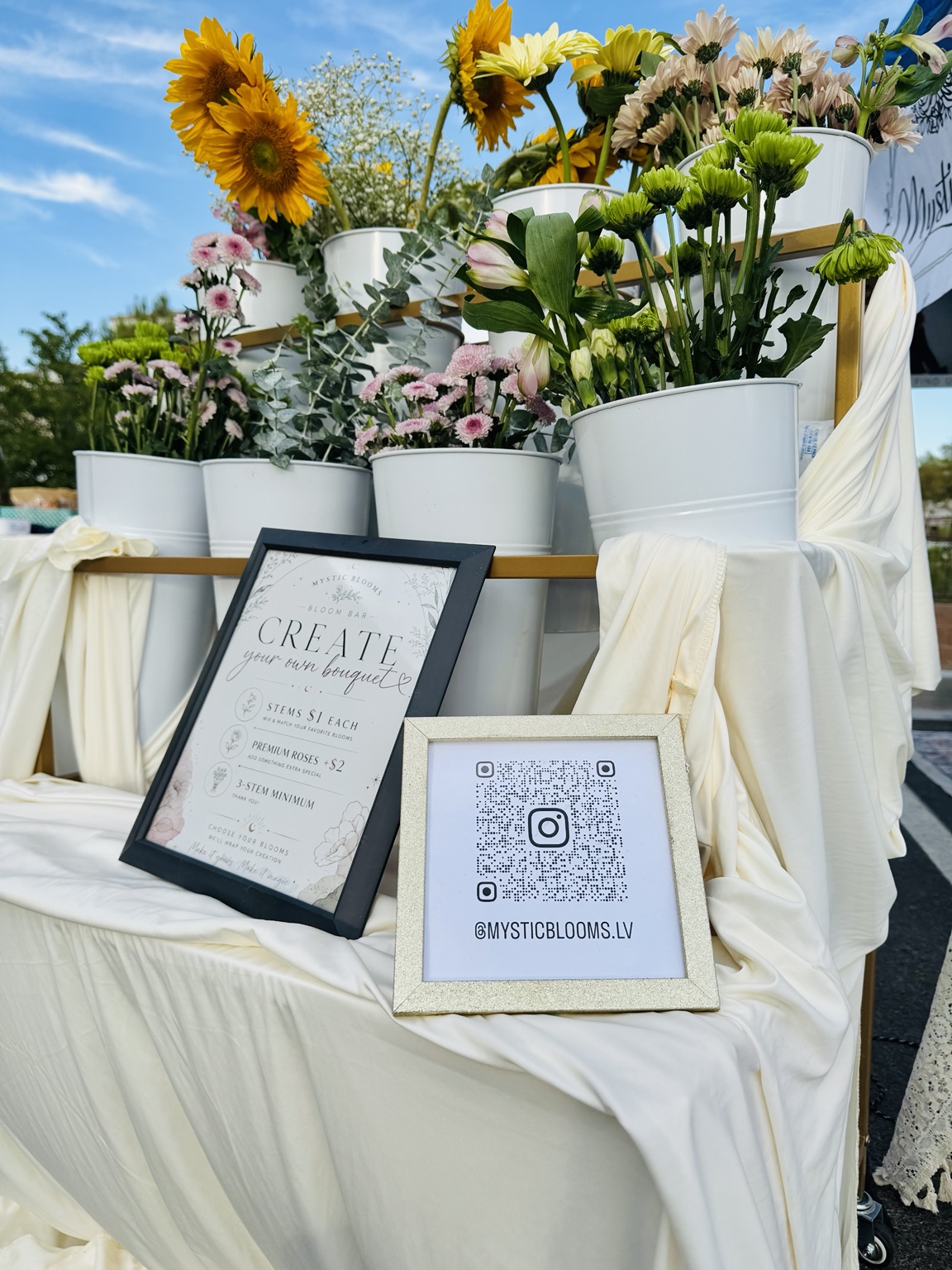 Outdoor Mystic Blooms Bloom Bar with fresh flowers and bouquet station