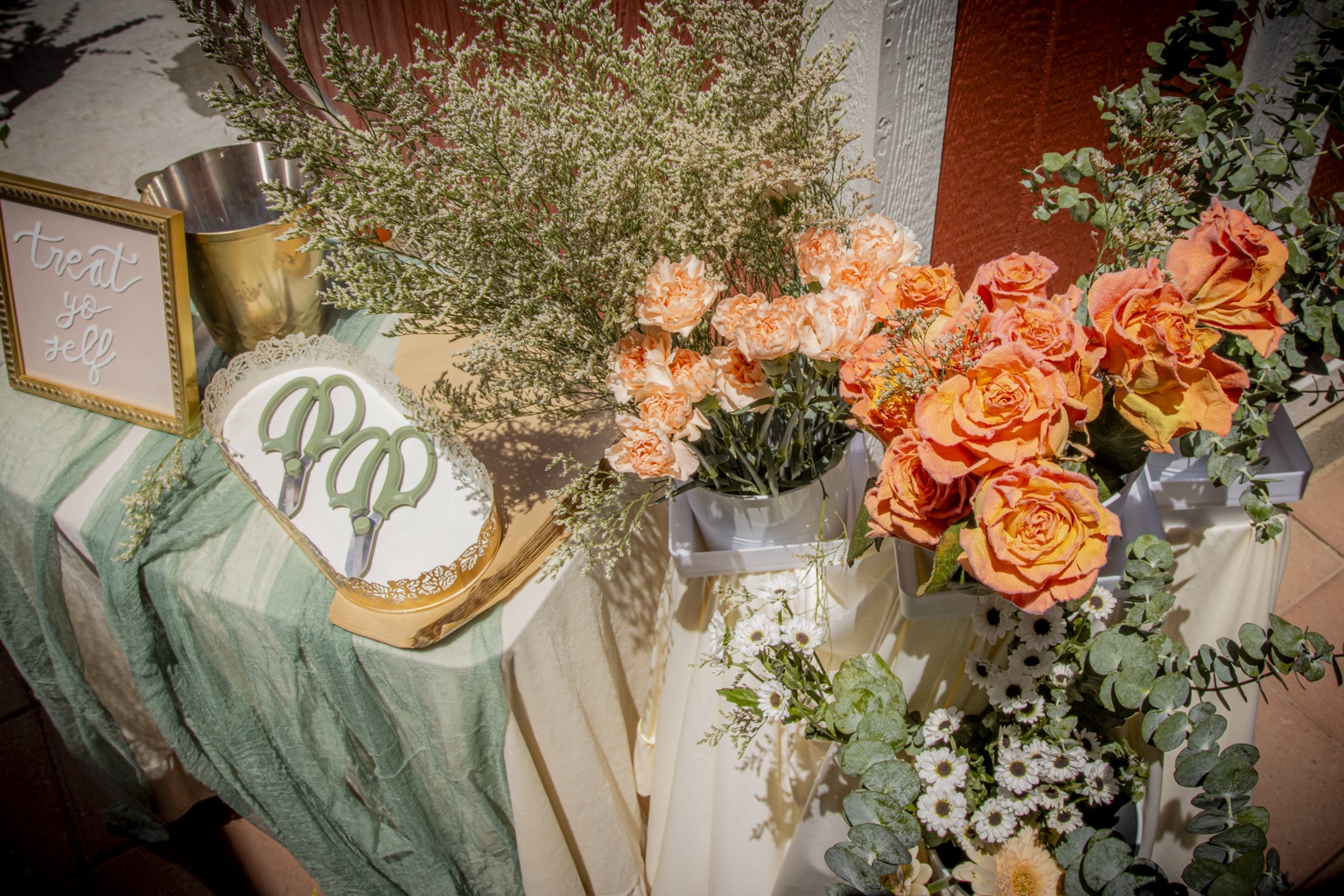Interactive outdoor flower bar with roses, carnations and greenery